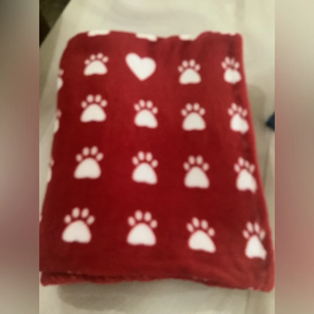 Doggie blanket a red & white with prints on it soft & cozy. 77”x50” clea…